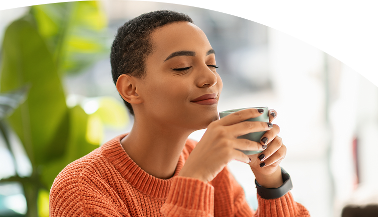 Young man drinking from a mug