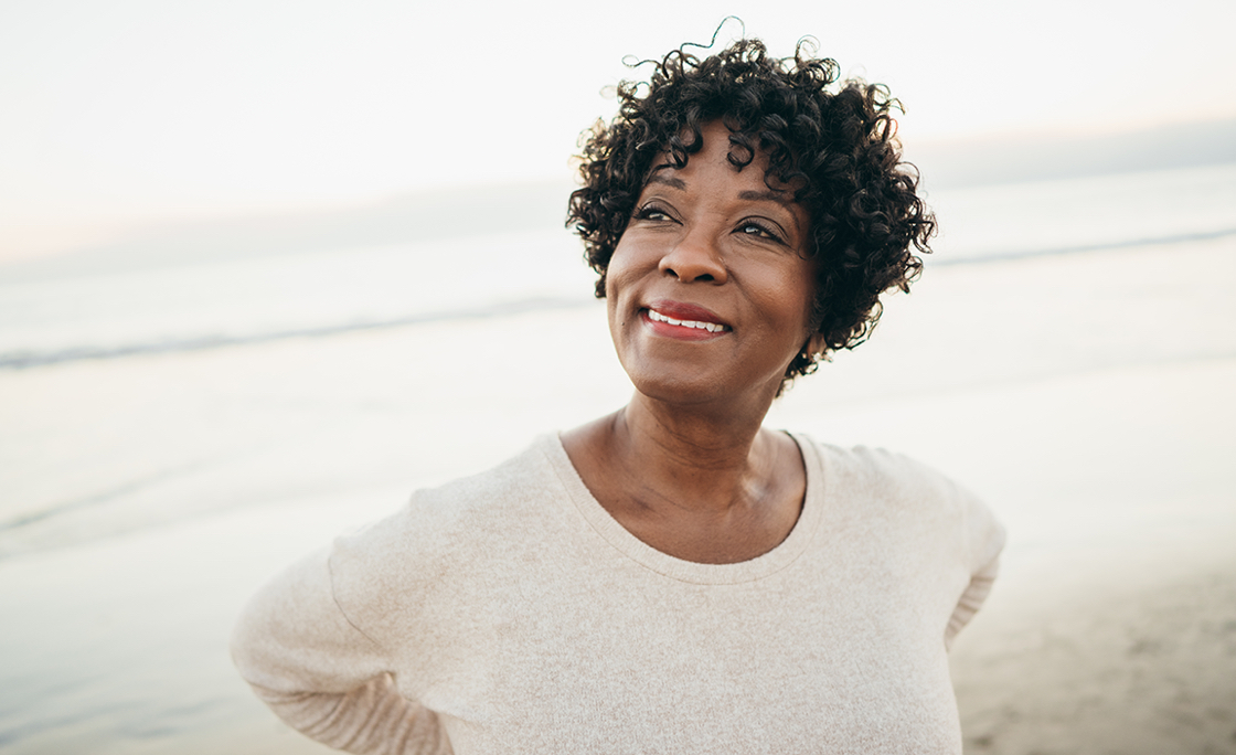 A woman standing on a beach
