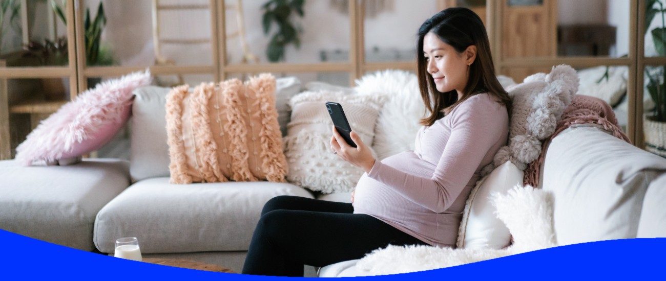 A pregnant woman using her smartphone